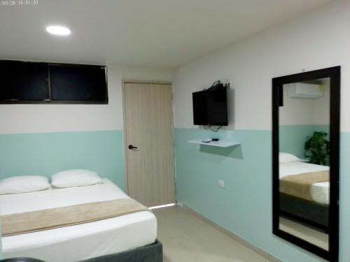 Ένα ή περισσότερα κρεβάτια σε δωμάτιο στο Hotel HIH