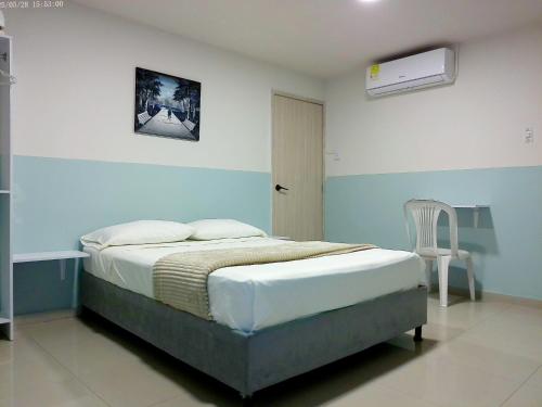 Ένα ή περισσότερα κρεβάτια σε δωμάτιο στο Hotel HIH