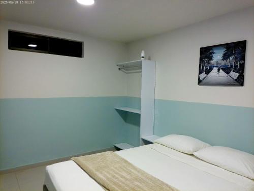 Ένα ή περισσότερα κρεβάτια σε δωμάτιο στο Hotel HIH