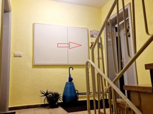 a whiteboard on a wall with an arrow on it at Holiday Apartment near Triberg Waterfall in Triberg