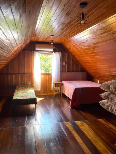 Katil atau katil-katil dalam bilik di Pousada Casa Wachholz - Rota do Enxaimel