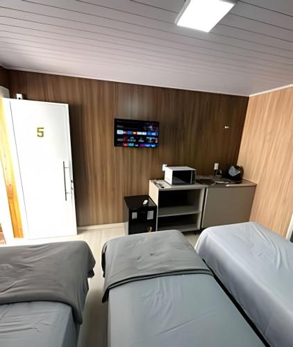 Televisyen dan/atau pusat hiburan di Loft Lux 5 (Smart TV, Ar condicionado, Cozinha...)
