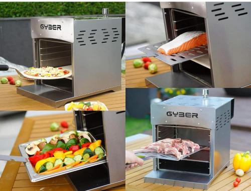 a meat oven with a plate of fruit and vegetables at CHalet DREAM LAND in Huntingdon