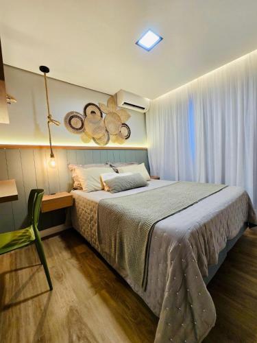 Ένα ή περισσότερα κρεβάτια σε δωμάτιο στο Apartamento com vista praia Ponta Negra