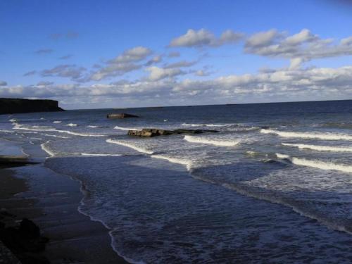 a view of the ocean from the beach at Bronte s Coastal Retreat in Tracy-sur-Mer