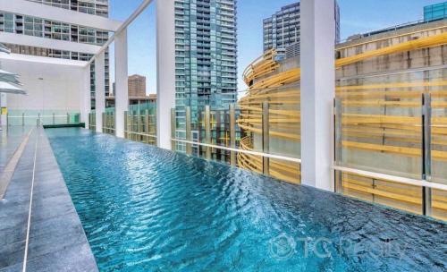 a swimming pool on the roof of a building at Darling Harbour 2b apt Car space upon request ICC CBD family friendly with view in Sydney