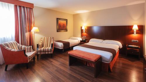 Ένα ή περισσότερα κρεβάτια σε δωμάτιο στο Hospedium Hotel Mirador de Gredos