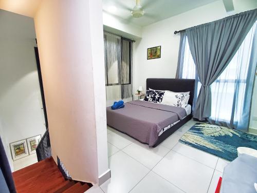 Ένα ή περισσότερα κρεβάτια σε δωμάτιο στο AZ Suites 2 @Cyberjaya Putrajaya