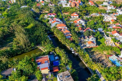 an aerial view of a village with a river at Mayci Boutique Hotel & Restaurant by Amber in Hoi An