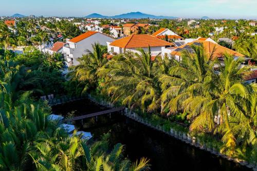 an aerial view of a city with palm trees at Mayci Boutique Hotel & Restaurant by Amber in Hoi An