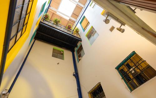 an overhead view of a white building with windows at Community Hostel Quito in Quito