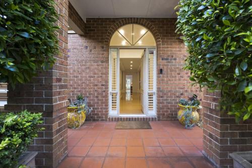 an entrance to a brick building with a doorway at Mariner in Rye