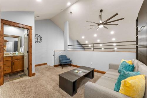 a living room with a couch and a table at Penthouse Eagle View - for 12 in Branson