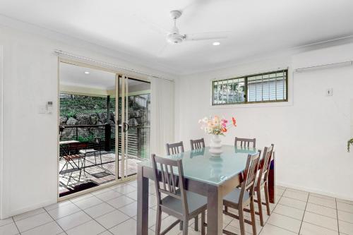 a dining room with a table and chairs at Golden Moments Family Stay in Gold Coast