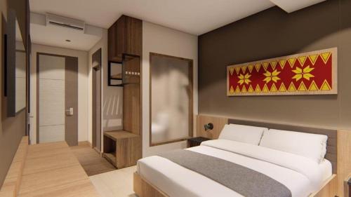 a bedroom with a large bed in a room at Mega Permata Hotel in Padangsidimpuan