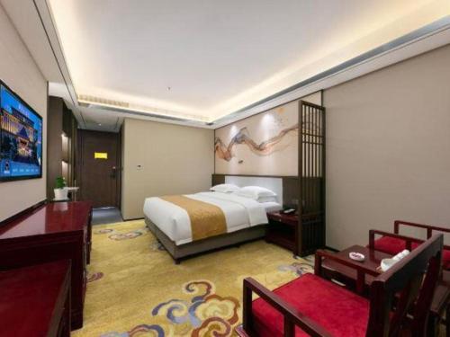 Postel nebo postele na pokoji v ubytování Dengfeng Chanwu Hotel