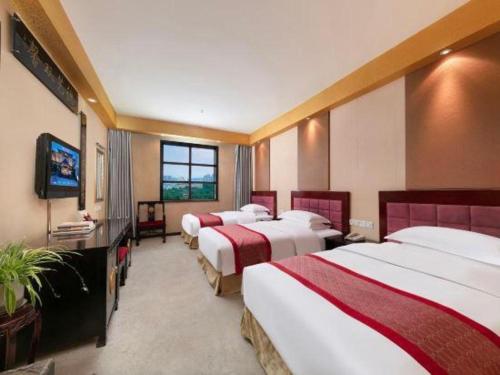 Postel nebo postele na pokoji v ubytování Dengfeng Chanwu Hotel