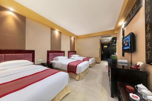 TV a/nebo společenská místnost v ubytování Dengfeng Chanwu Hotel