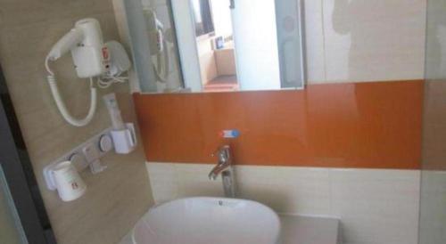 a bathroom with a toilet and a mirror at 7 Days Premium Beijing Dabaotai Metro Station Luhua Road in Beijing