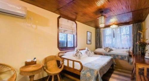 Ένα ή περισσότερα κρεβάτια σε δωμάτιο στο The Courtyard Suzhou Inn Hemu Branch