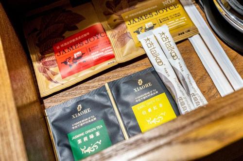 a group of books sitting on a shelf at James Joyce Coffetel·Anyang Text Museum in Anyang