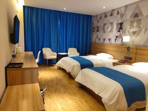 Кровать или кровати в номере PAI Hotel·Ulan Chaka Salt Lake