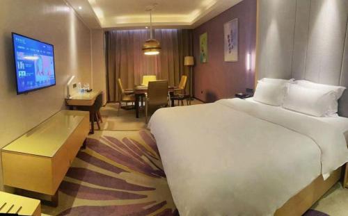 Letto o letti in una camera di Lavande Hotel·Yichun Wanda, High Speed Railway Station