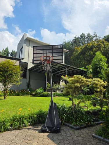 a basketball hoop in front of a house at Royal Hill Villa Cisarua Puncak in Puncak