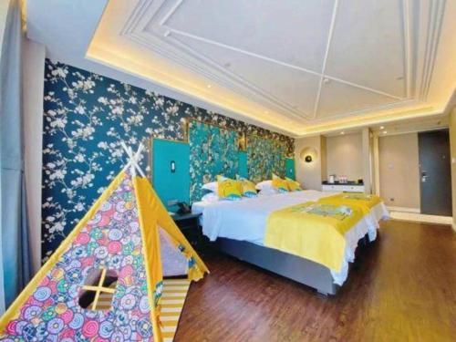 a bedroom with a large bed and a tent at James Joyce Coffetel Harbin West High-speed Railway Station Wanda Plaza in Harbin