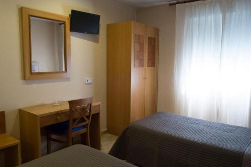 Ένα ή περισσότερα κρεβάτια σε δωμάτιο στο Hostal Azul