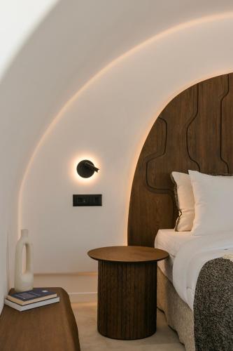 Ένα ή περισσότερα κρεβάτια σε δωμάτιο στο Acro Caldo Suites