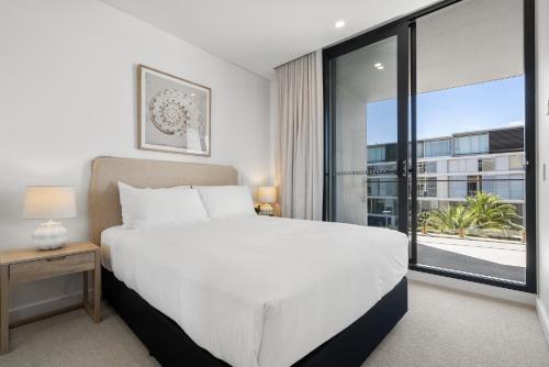 Postel nebo postele na pokoji v ubytování Trendy 1-Bed Retreat in Fremantle with Rooftop