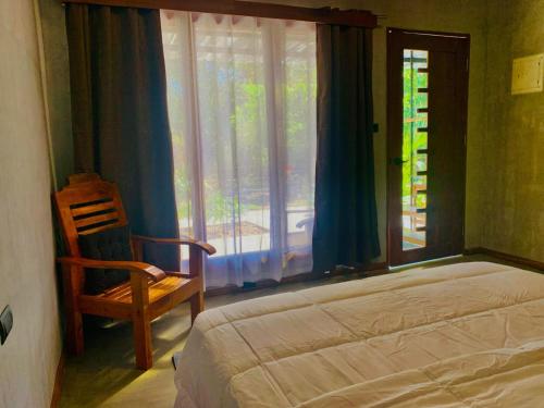 Ein Bett oder Betten in einem Zimmer der Unterkunft Mulawin B&B