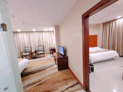 TV a/nebo společenská místnost v ubytování Wanxiang Hotel