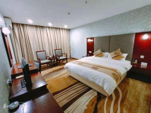 Postel nebo postele na pokoji v ubytování Wanxiang Hotel