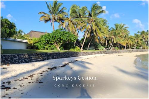 a pile of sand on a beach with palm trees at SG14 Villa Seabreeze - seaside - lagoon view in Post of Flacq