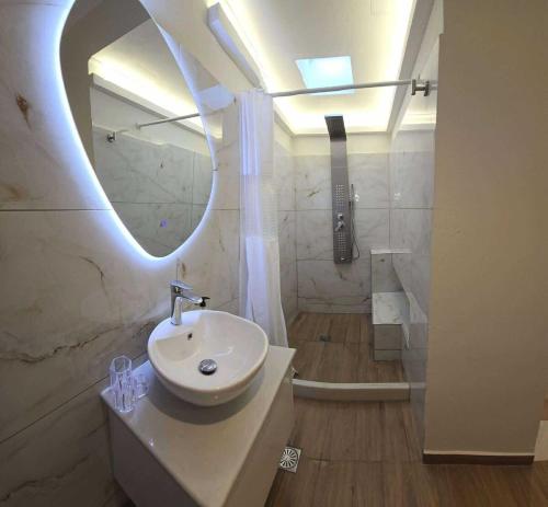 a bathroom with a sink and a mirror at Heavens View in Pyrgi