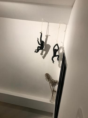 two people hanging from ropes on the ceiling of a room at Loft 90m2 avec spa chauffé unique à Lyon in Lyon