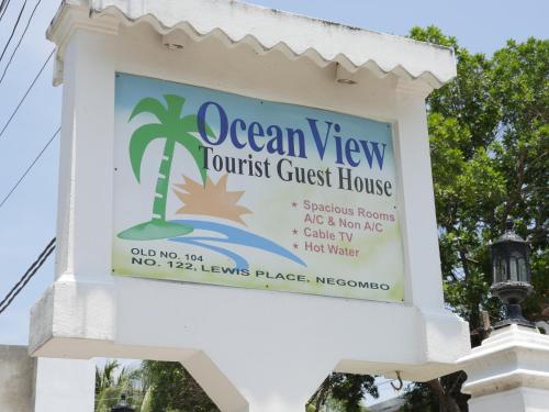a sign for the ocean view tourist guest house at Ocean View tourist guest house at Negombo beach near the airport in Negombo