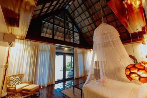 Postel nebo postele na pokoji v ubytování Isla Cabana Resort