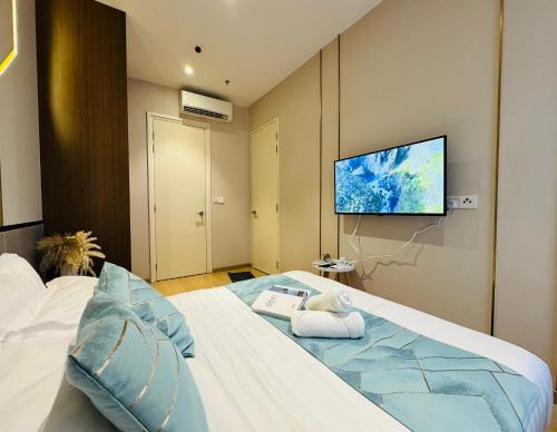 Ένα ή περισσότερα κρεβάτια σε δωμάτιο στο Hill10 Residence I-City by Deurban