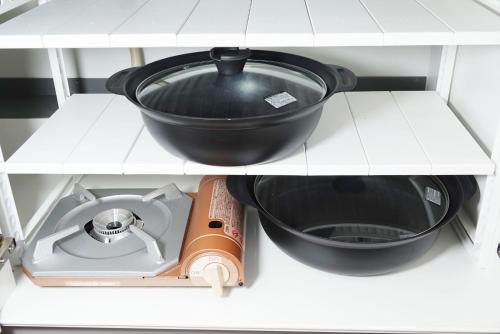 a black pot sitting on top of a stove in a kitchen at THE TORII in Kumamoto
