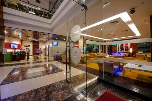 a lobby of a hotel with a reception area at Novotel Nha Trang in Nha Trang
