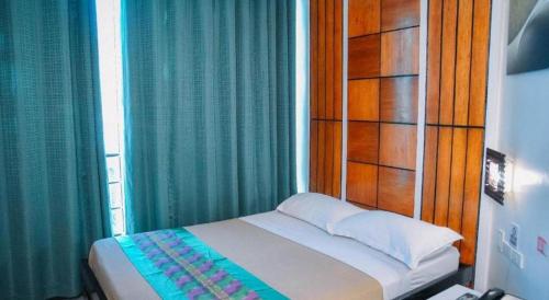 Postel nebo postele na pokoji v ubytování Marcian Business Hotel