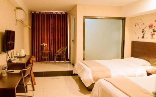 Katil atau katil-katil dalam bilik di Shell Zaozhuang Taierzhuang Ancient City East Gate Hotel