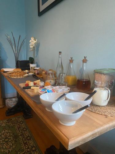 a wooden table with bowls and other items on it at Trecastle in Châlus