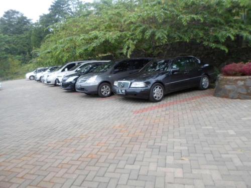 a row of cars parked in a parking lot at Fafa Hill Hotel and Resort in Bogor