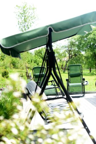 a group of chairs sitting on a golf cart at Agroturystyka w Dolinie Raty in Prusie