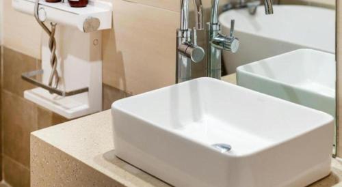 a bathroom with a white sink on a counter at Seven Motel Ansan in Ansan