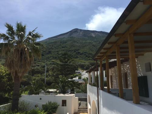 a view from a house with a mountain in the background at Villa Petrusa in Stromboli